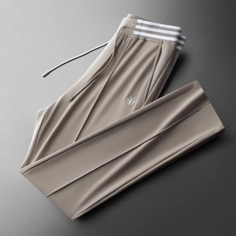 High end fashionable embroidered striped casual men's pants for the summer of 2024 new waffle ice silk comfortable sports pants
